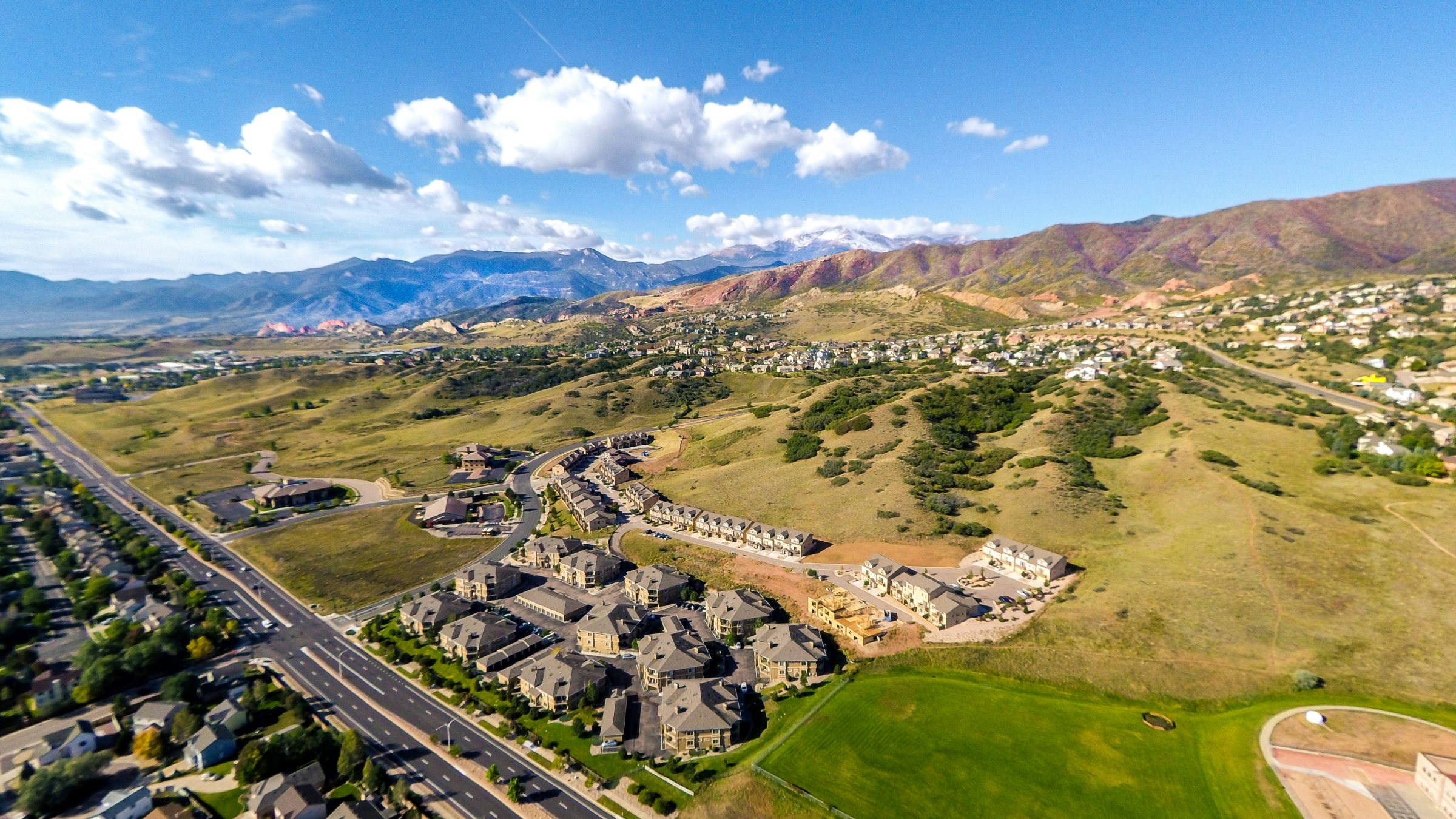 Aerial view of Colorado Springs rental homes with Pikes Peak and the Front Range in the background