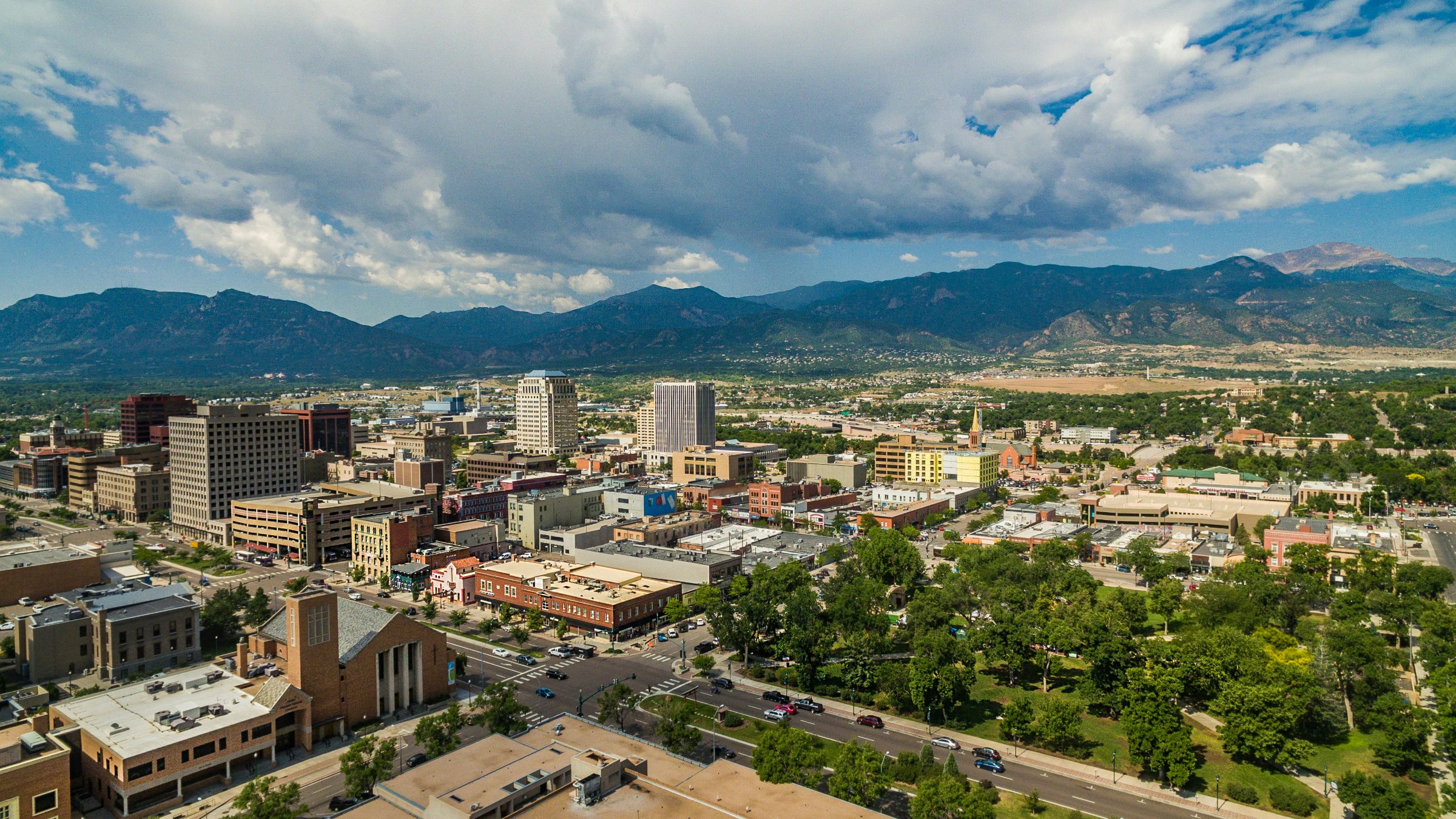 Downtown Colorado Springs rental property skyline with Pikes Peak behind it
